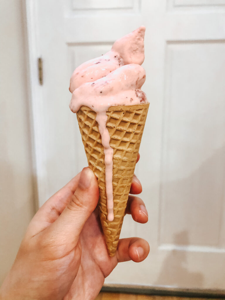 homemade strawberry ice cream soft serve in cone