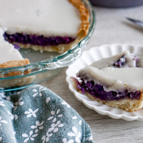 Okinawan sweet potato haupia pie with a slice cut out