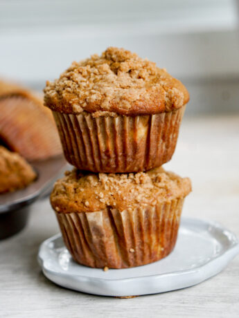 closeup shot of two kinako banana muffins stacked on top of each other