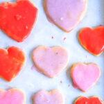 condensed milk cookies cut in hearts with red and pink icing