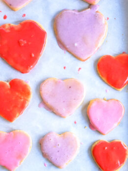 condensed milk cookies cut in hearts with red and pink icing